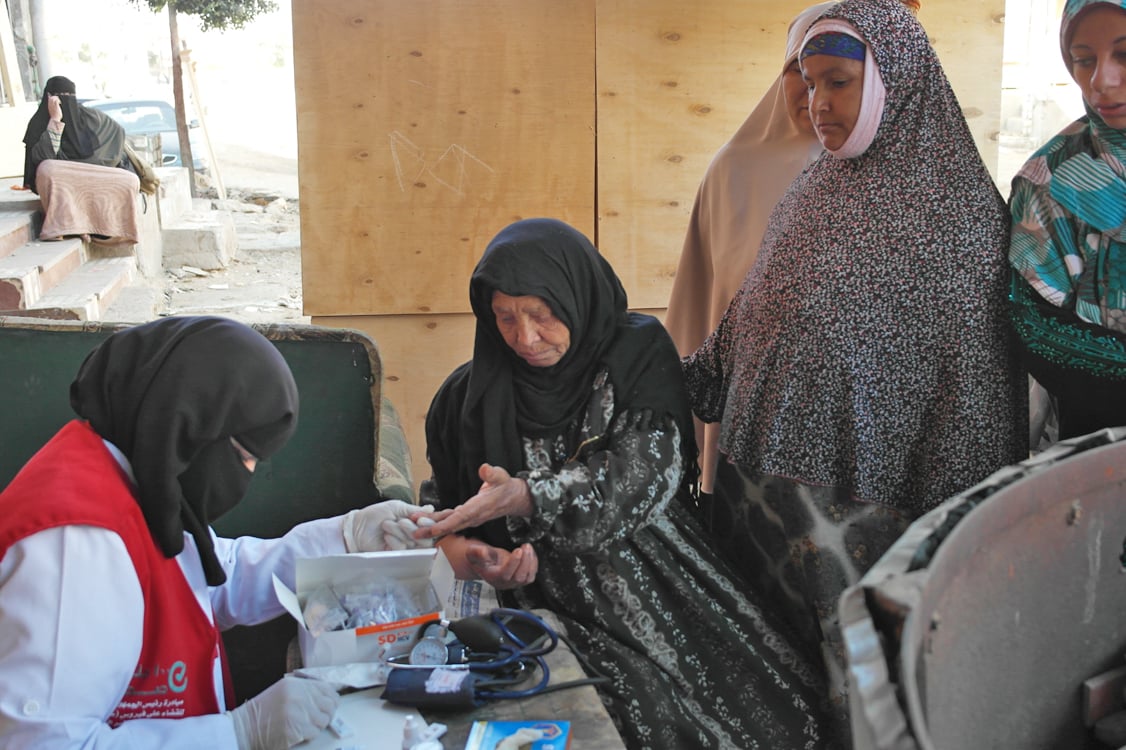 Women being tested for hepatitis C at their home in Egypt