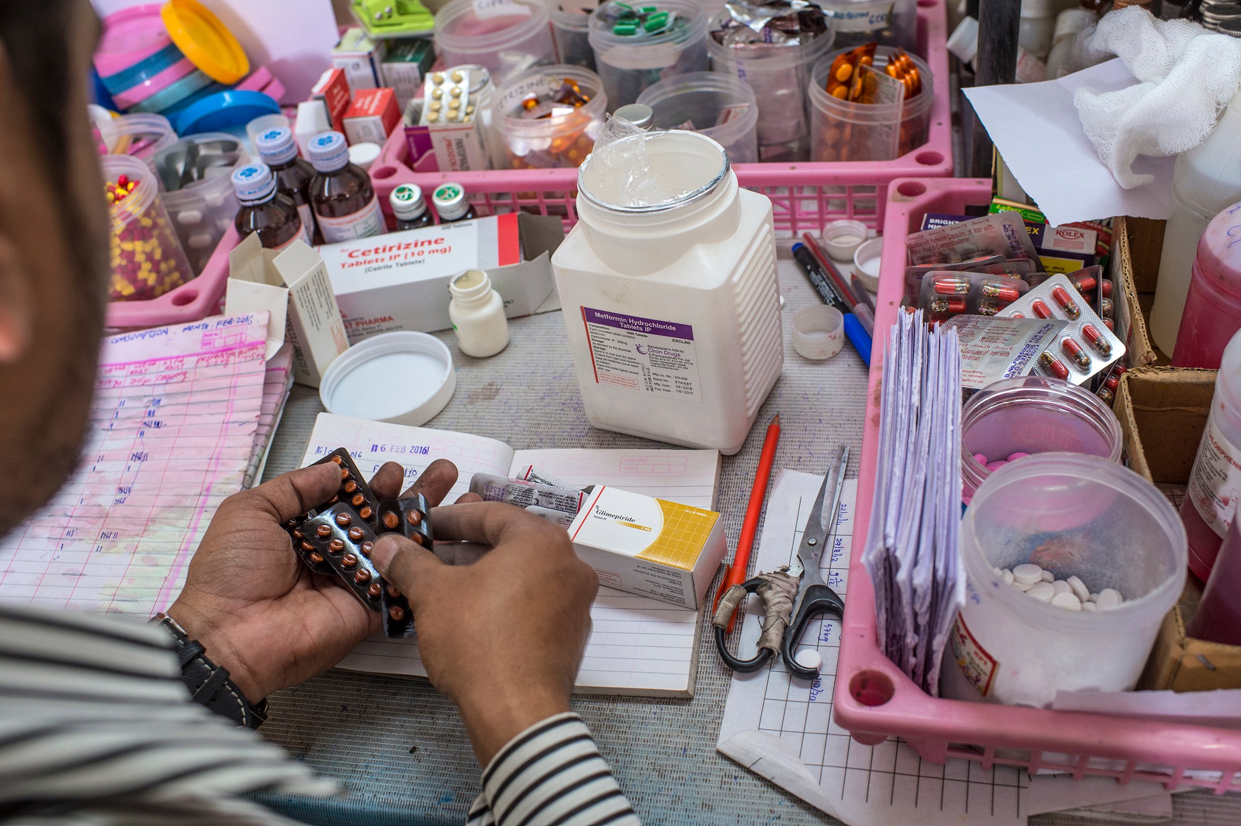 man manipulating medicines