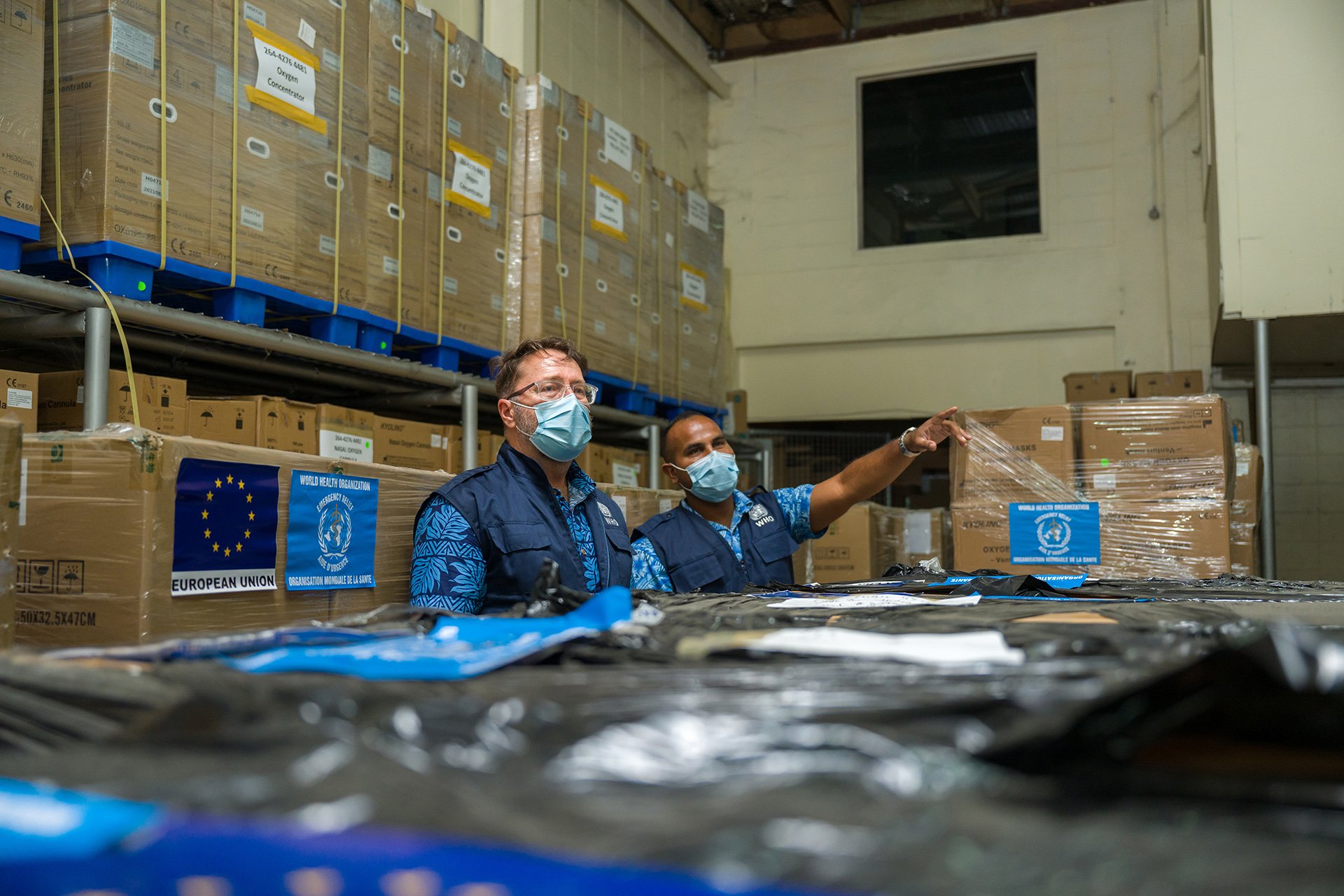 Dr Mark Jacobs with Adrian Chand in a Nadi warehouse